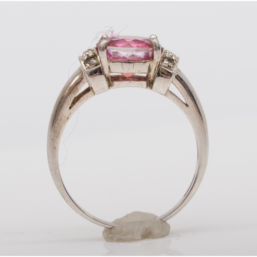 528 - A 9ct white gold coated pink topaz and diamond dress ring, O, 3.5gm.