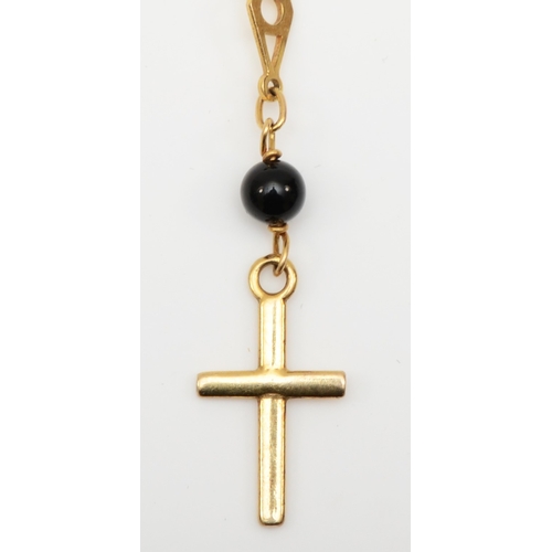 531 - A 9ct gold fancylink necklace with onyx beads and cross pendant, 18mm, 5.8gm.