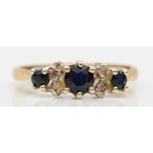 539 - A 9ct gold sapphire and diamond dress ring, O, 2.4gm.