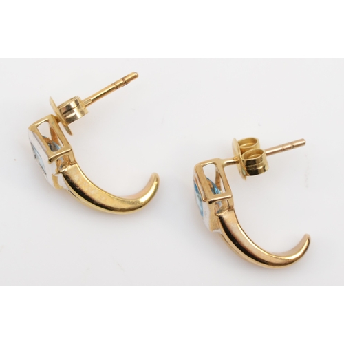 541 - A pair of 9ct gold blue topaz half hoop earrings, 15mm, 2.1gm.