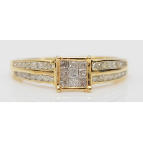 543 - A 9ct gold brilliant and square cut diamond cluster ring, O, 1.8gm.