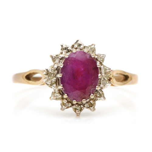 548 - A 9ct gold ruby and diamond cluster ring, Q, 2.2gm.