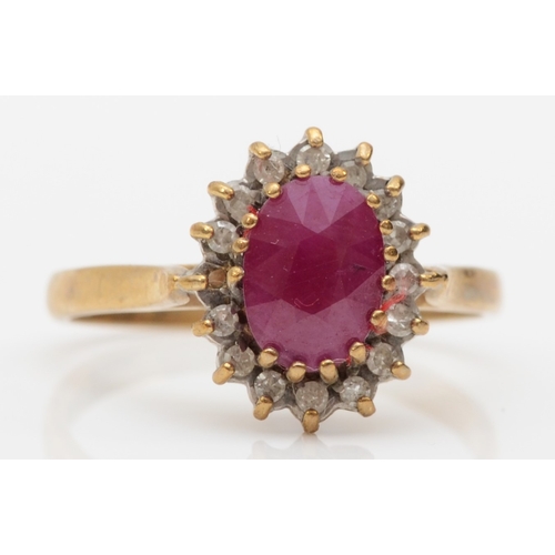 553 - A 9ct gold ruby and diamond dress ring, O-P, 2.5gm.