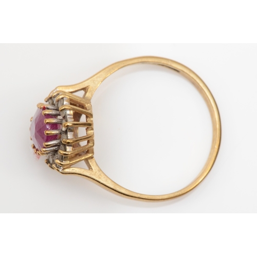 553 - A 9ct gold ruby and diamond dress ring, O-P, 2.5gm.