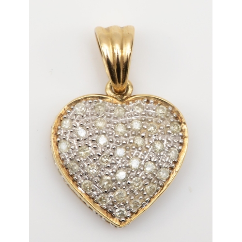 555 - A 9ct gold brilliant cut diamond cluster heart shaped pendant, 23 x 15mm, 2.8gm.