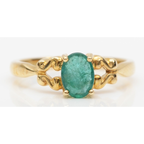 556 - A 9ct gold single stone emerald dress ring, O, 2.3gm.