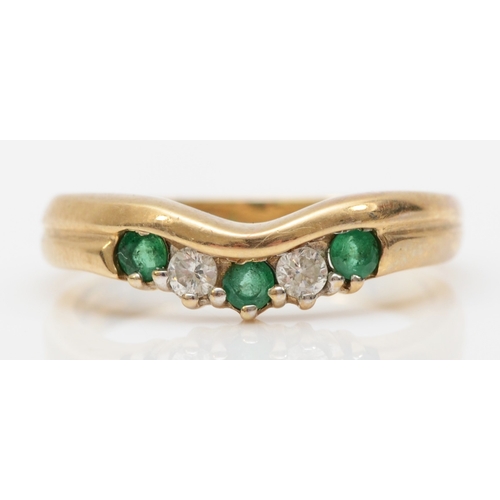 557 - A 9ct gold emerald and brilliant cut diamond dress ring, O, 3gm.