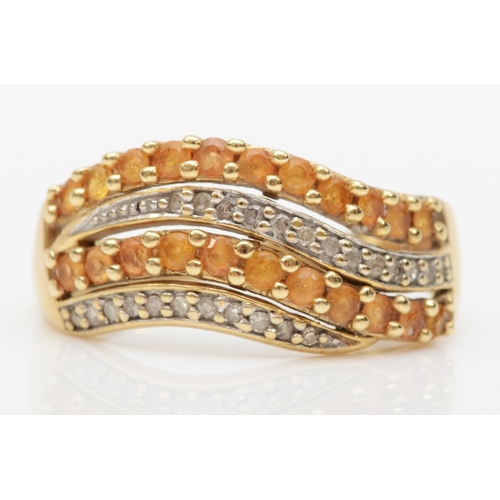 559 - A 9ct gold eight cut diamond and yellow stone dress ring, P, 2.8gm.