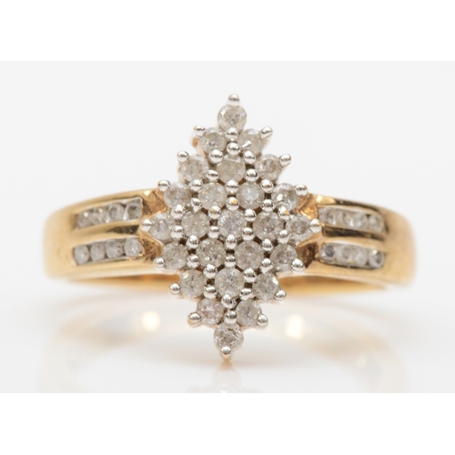 560 - A 9ct gold brilliant cut diamond cluster ring, M, 3.5gm.