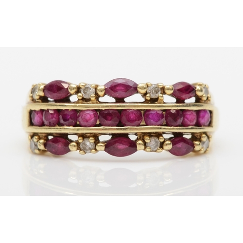 561 - A 9ct gold ruby and brilliant cut diamond dress ring, Q-R, 3.6gm.