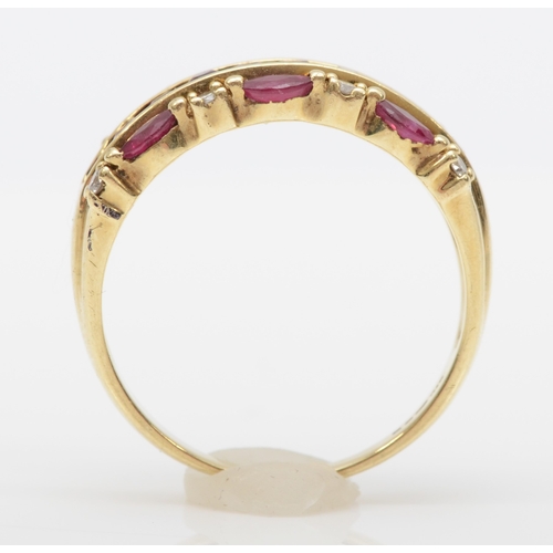 561 - A 9ct gold ruby and brilliant cut diamond dress ring, Q-R, 3.6gm.