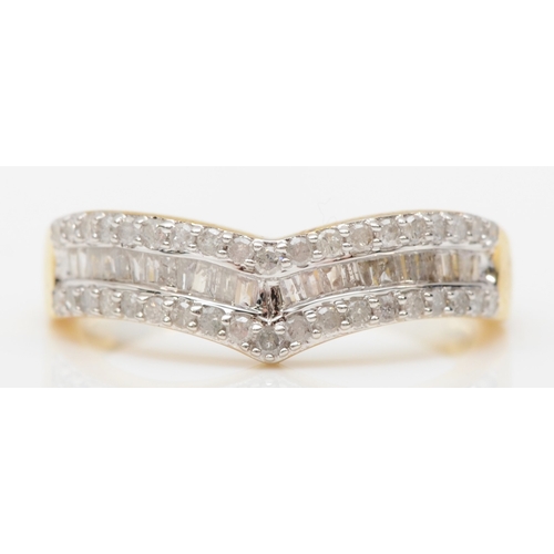 562 - A 9ct gold brilliant and baguette cut diamond dress ring, O, 2.5gm.