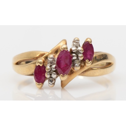 565 - A 10k gold ruby and diamond dress ring, K, 1.8gm.