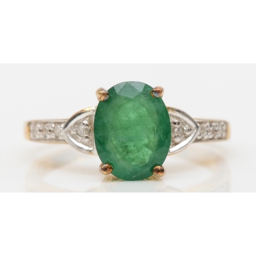 566 - A 9ct gold emerald dress ring, with eight cut diamond shoulders, M, 2.2gm.