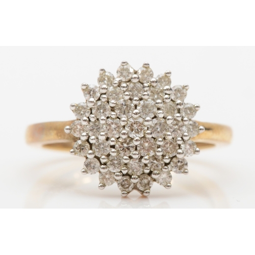 570 - A 9ct gold brilliant cut diamond cluster ring, N, 3.8gm.