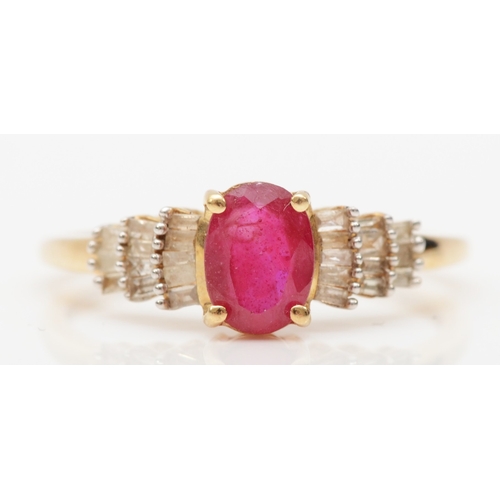 572 - A 9ct gold glass filled ruby and baguette cut diamond dress ring, P, 1.9gm.