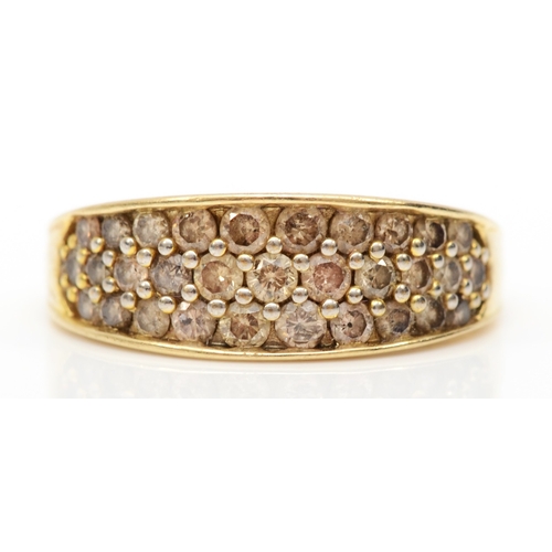 576 - A 9ct gold brilliant cut diamond dress ring, O, 3gm.