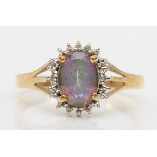 577 - A 9ct gold mystic topaz and diamond dress ring, N, 2.1gm.