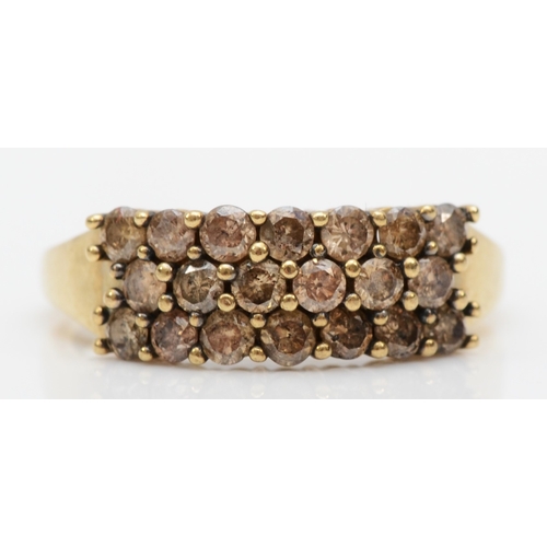 583 - An unmarked gold brown treated brillaint cut diamond cluster ring, N, 1.8gm.