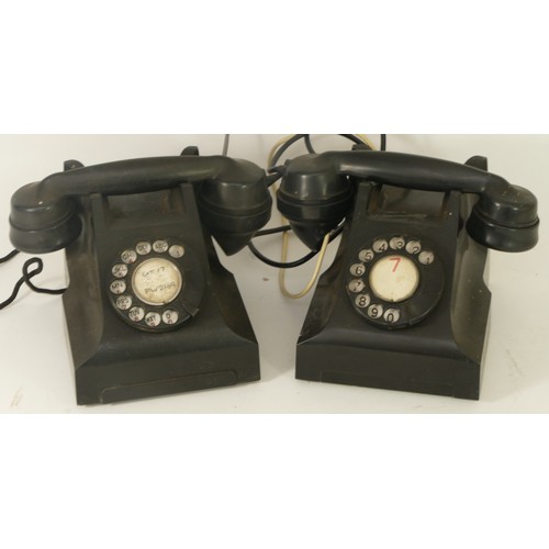 27 - Two 20th century black Bakelite telephones, each with dialing plates.