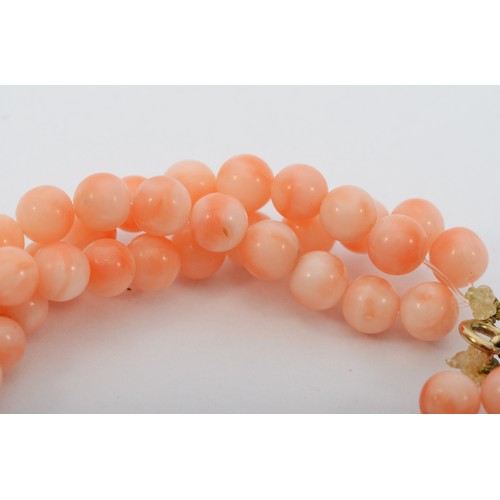 45 - A 9ct gold clasped coral three strand beaded necklace, 40cm.