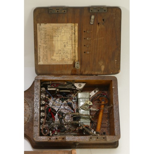 64 - A pair of early 20th century oak mounted telephones together with various other electrical equipment