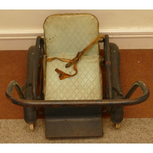 68 - An Edwardian child's metal and leather dolls push chair, 67 x 70cm.