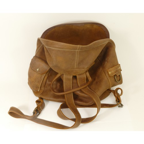 307 - Roots, Made in Canada, leather backpack with beaver tag. Front and top zip pockets, side phone press... 