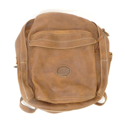 307 - Roots, Made in Canada, leather backpack with beaver tag. Front and top zip pockets, side phone press... 