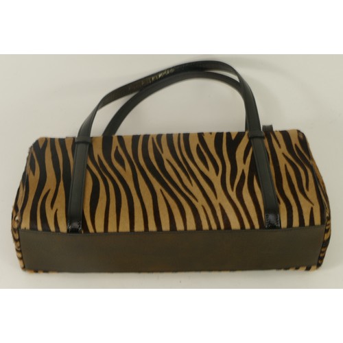 304 - Cartier handbag, animal hide, zebra, brown. Leather fob with metallic Cartier emblem.  Fold over lip... 