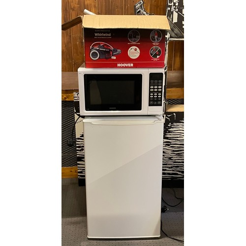 66 - A freestanding larder fridge, 83x50cm together with a Kenwood microwave and a Hoover Whirlwind vacuu... 