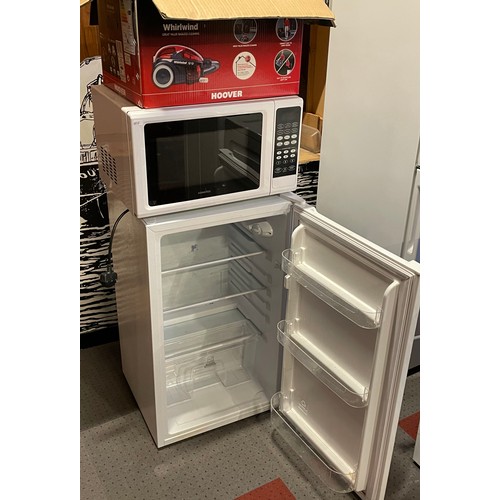 66 - A freestanding larder fridge, 83x50cm together with a Kenwood microwave and a Hoover Whirlwind vacuu... 