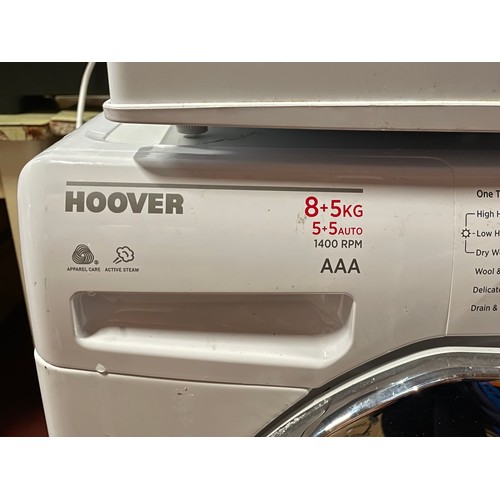 70 - A Hoover Dynamic washing machine, AAA rated, 1400 RPM, together with LEC table top larder fridge, H4... 