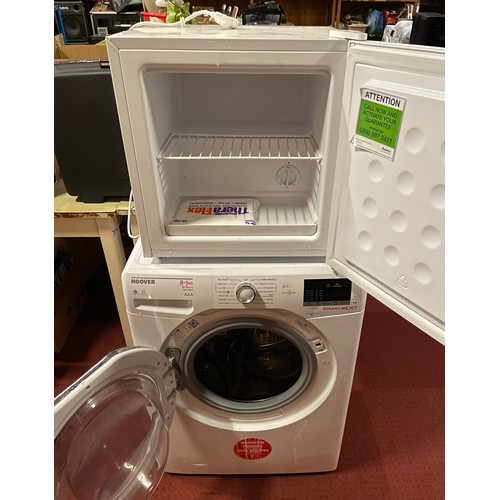 70 - A Hoover Dynamic washing machine, AAA rated, 1400 RPM, together with LEC table top larder fridge, H4... 