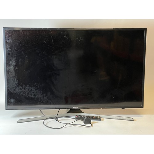 72 - A Samsung TV 40 inch, model VE40 MU6120K, with power lead and remote control.