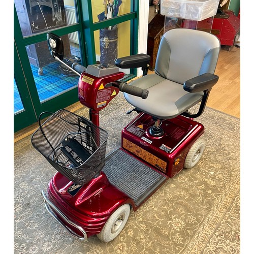 90 - A Shoprider four wheeled mobility scooter, complete with charger in working order.