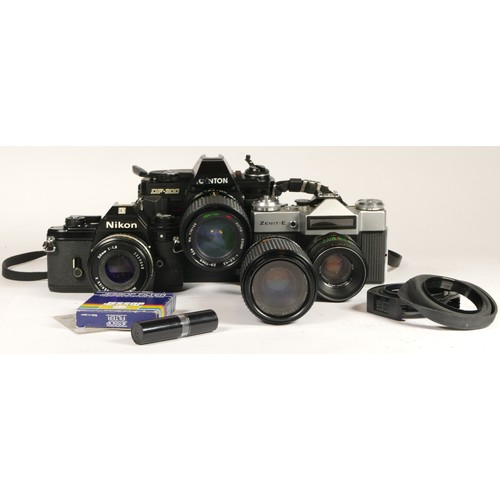 92 - Three 35mm cameras and accessories, to include a Nikon EM, a Centon DF-300, a Zenit-E, cased with le... 