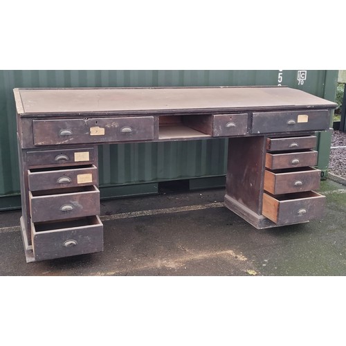 A large Victorian crackle glazed pine clerks desk, the sloped ...