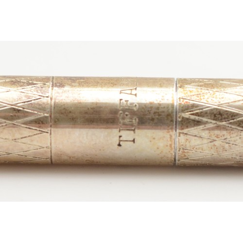 68 - A silver Tiffany & Co pen with engraved diamond decorated body, 11.5cm.