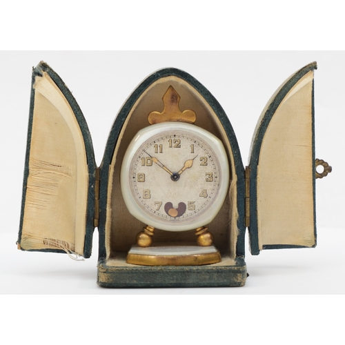 76 - An early 20th century Brevet brass and mother of pearl cased traveling clock, the silvered dial set ... 