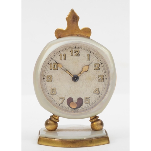 76 - An early 20th century Brevet brass and mother of pearl cased traveling clock, the silvered dial set ... 