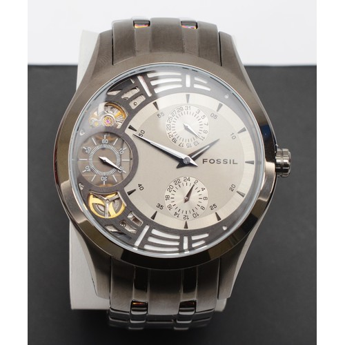 95 - Fossil, a grayed stainless steel Twist gentleman's automatic wristwatch, ME-1012, together with chro... 