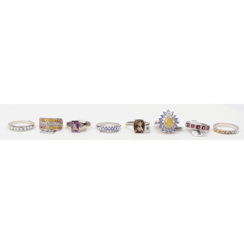 125 - Eight silver gem set rings to include a tanzanite dress ring U, 37gm.