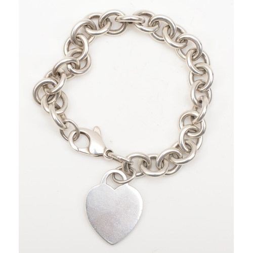 133 - A silver Tiffany & Co bracelet with heart shaped tag, 26 x 20mm, 35gm.