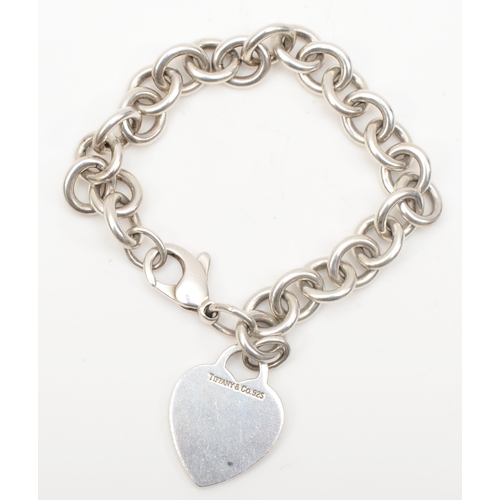 133 - A silver Tiffany & Co bracelet with heart shaped tag, 26 x 20mm, 35gm.