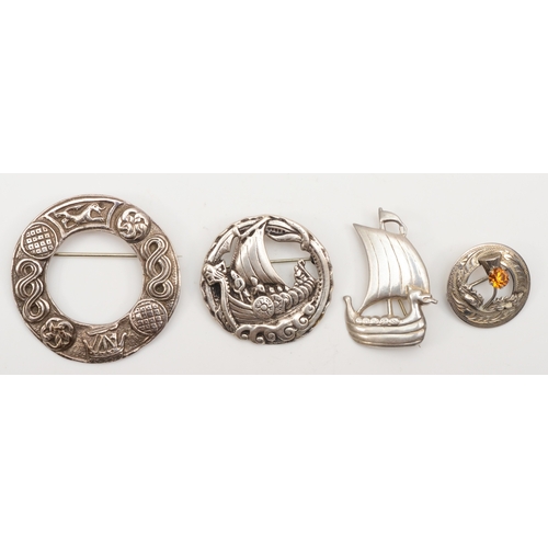 Four Scottish silver brooches to include a Viking long boat, by Shetland Silvercraft, Edinburgh 1957, 41 x 28mm, two with Chester hallmarks, 1947 and 1955, 54gm.