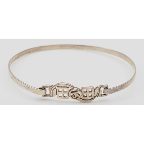 141 - A silver Celtic knot bracelet by Kit Heath, 17.5cm, together with four silver bracelets, 44gm.