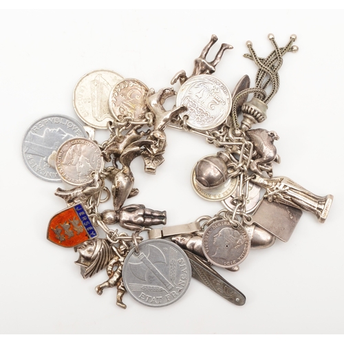 144 - A silver charm bracelet to include coins , 84gm.