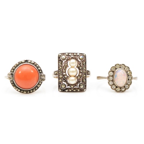 162 - A 9ct gold and silver set coral dress ring, N, together with two 9ct gold and silver dress rings, 10... 