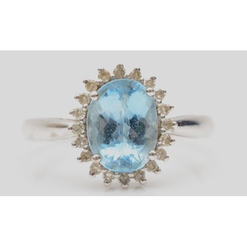 164 - A 9ct white gold aquamarine and eight cut diamond cluster ring, R-S, 3.1gm.